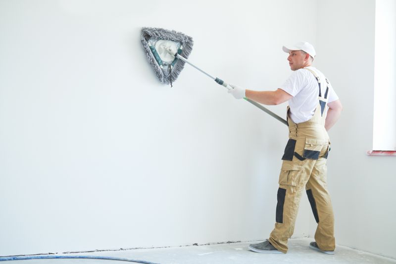 Handyman Painting a Wall